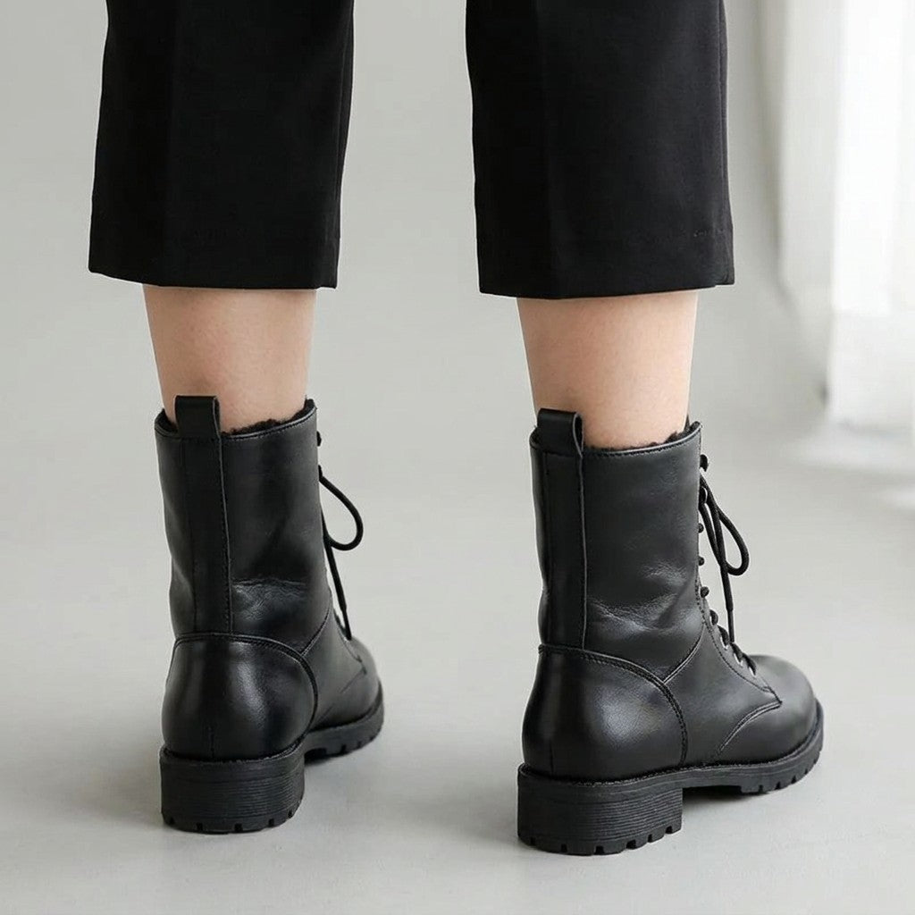 Back view of Lysandra boots showing the heel pull loops and treaded soles