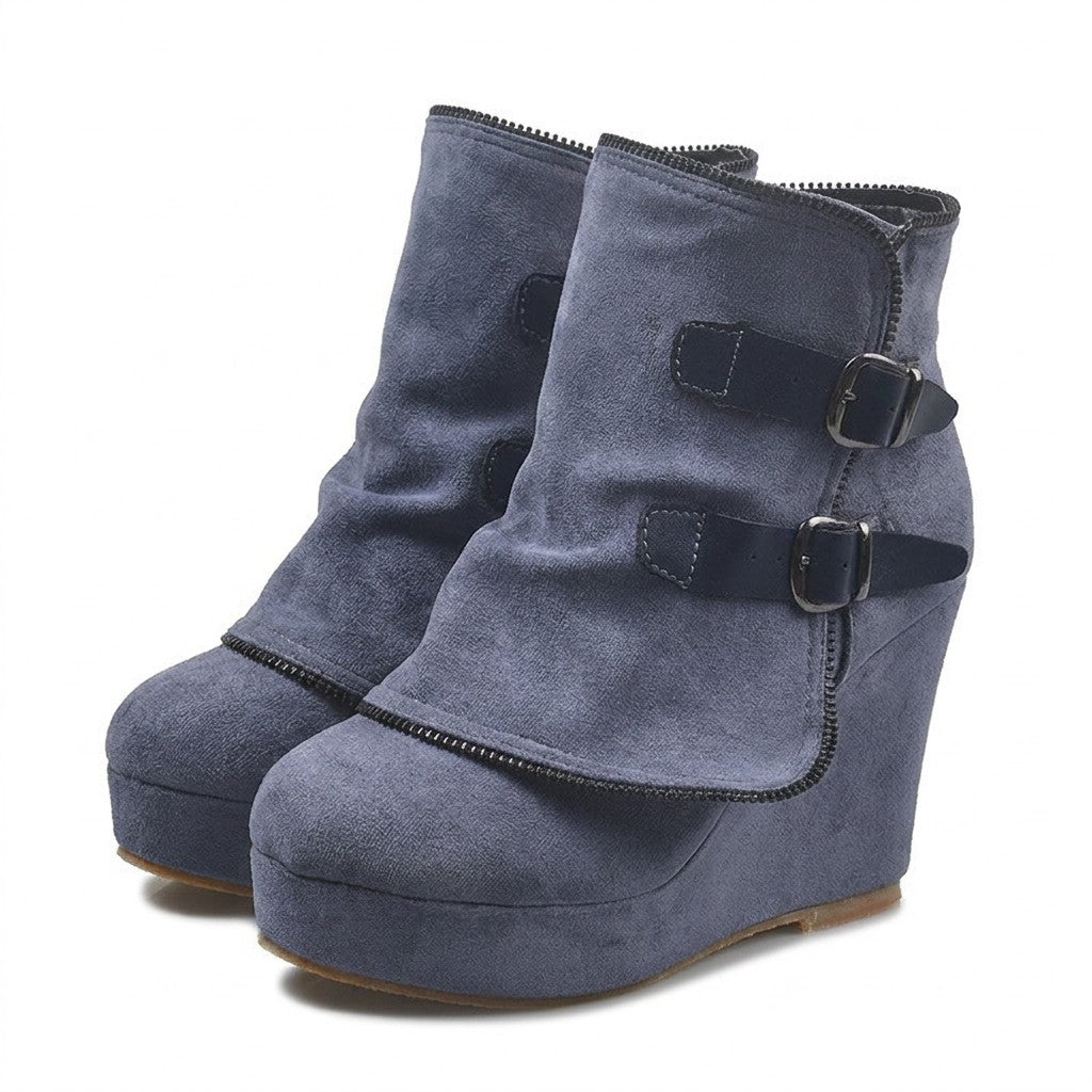 Pair of slate-blue Saskia suede wedge ankle boots on white with navy leather straps