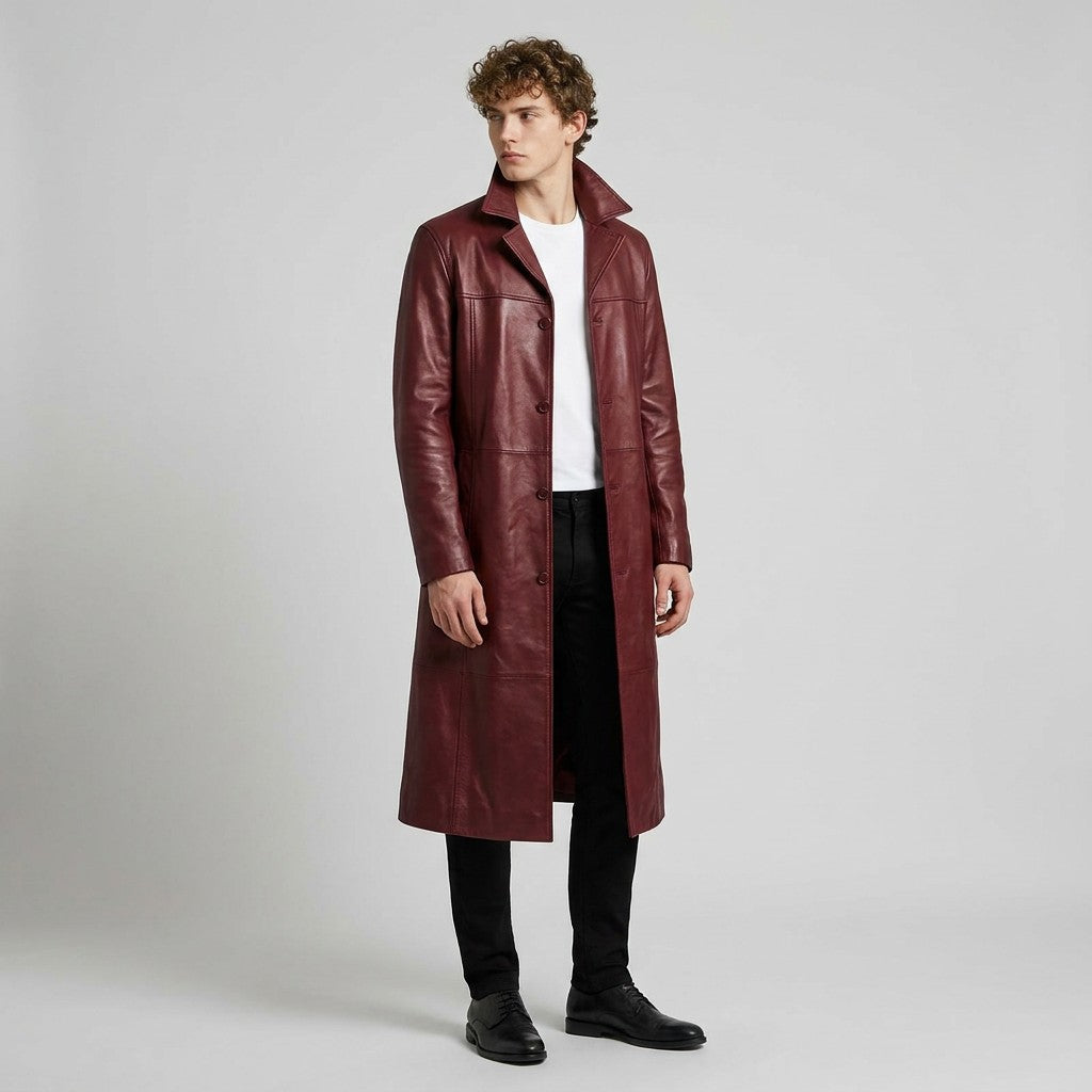 Model in the burgundy Anselm long coat with black trousers, looking to the side