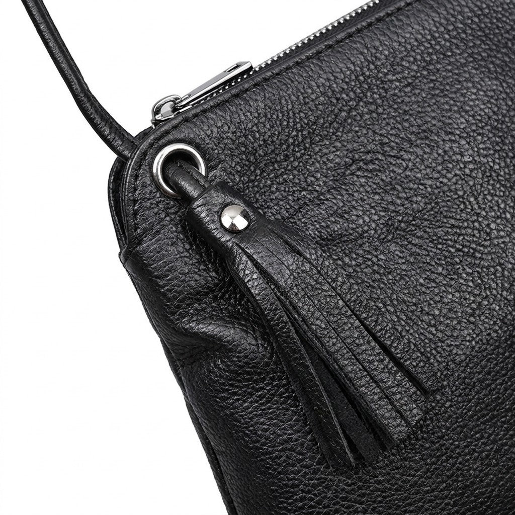 Close-up of the Solveig leather tassel, silver eyelet and knotted cord