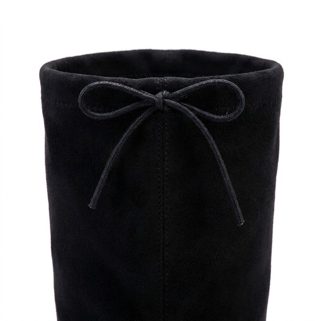 Close-up of the Oriane back drawstring bow and centre-back seam on black stretch suede