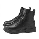 Pair of black Matthis men's leather work boots with lug soles, side view on white