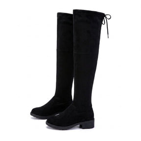 Pair of black Oriane suede over-the-knee boots on white, side view with low block heel