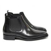 Pair of black polished Jasper men's Chelsea boots with chisel toe, side view on white
