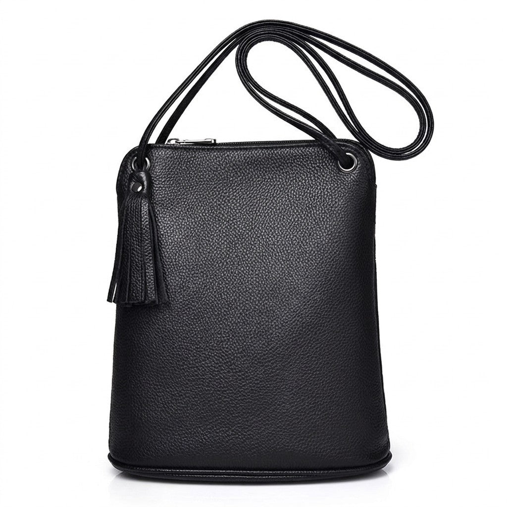 Front view of the black Solveig leather crossbody bag with tassel and cord strap on white