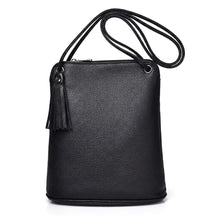 Front view of the black Solveig leather crossbody bag with tassel and cord strap on white