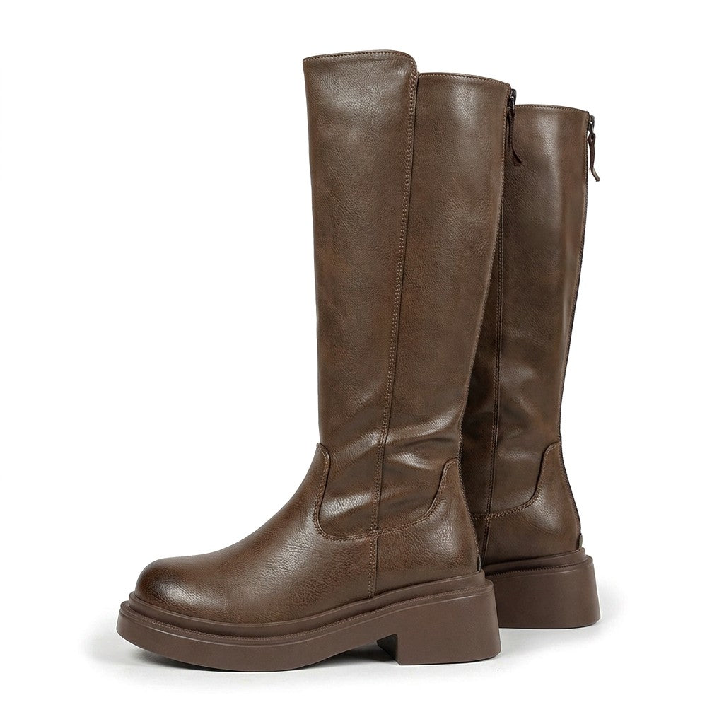Pair of mocha brown Mirabel leather knee high boots with chunky platform soles on white