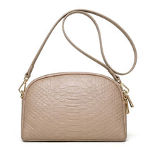 Taupe beige Isaure croc-embossed leather crossbody bag with matching strap on white