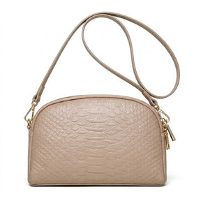 Taupe beige Isaure croc-embossed leather crossbody bag with matching strap on white