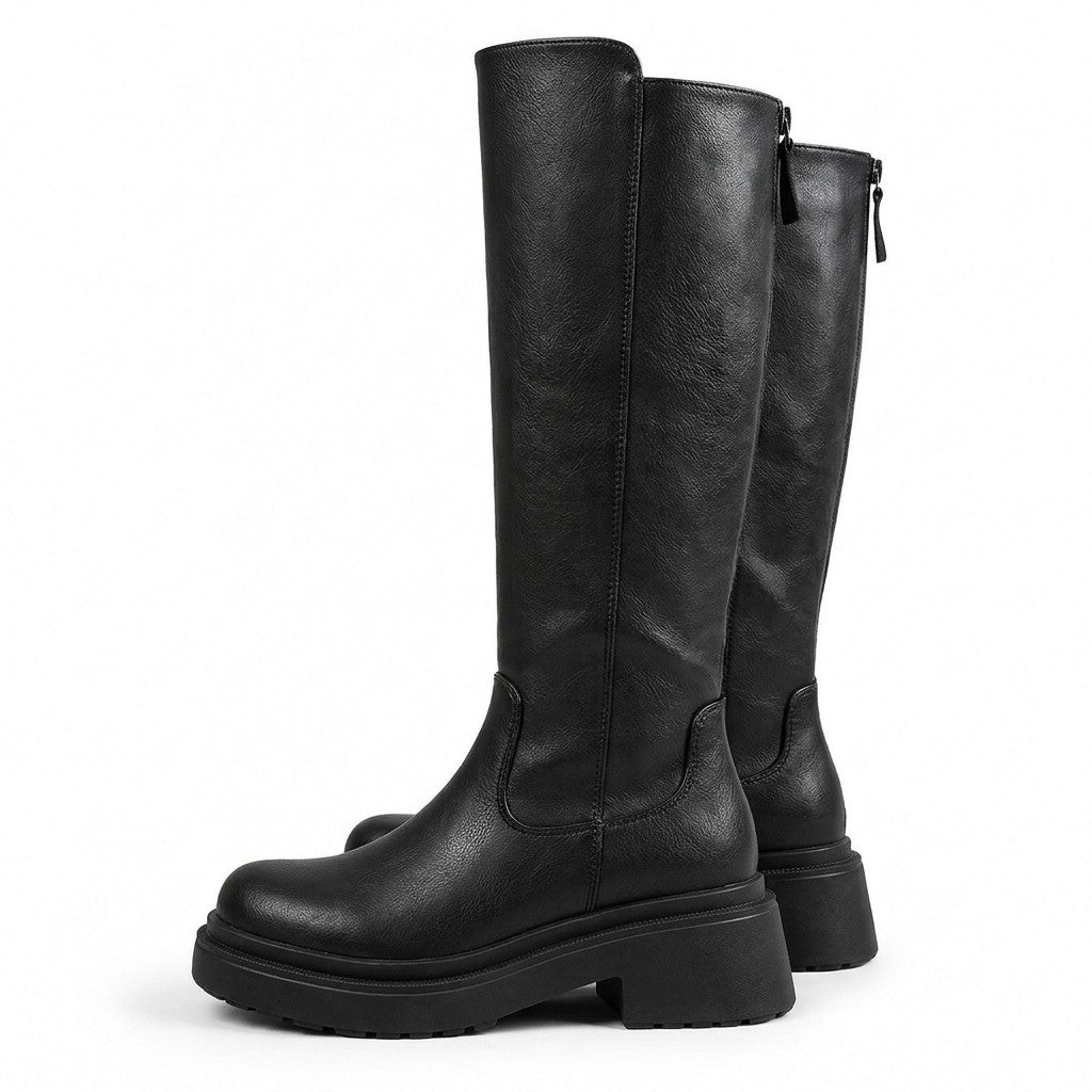 Pair of black Mirabel leather riding boots with treaded platform soles and back zip