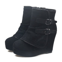 Pair of black Saskia suede wedge ankle boots on white with fold-over zip-trimmed panel