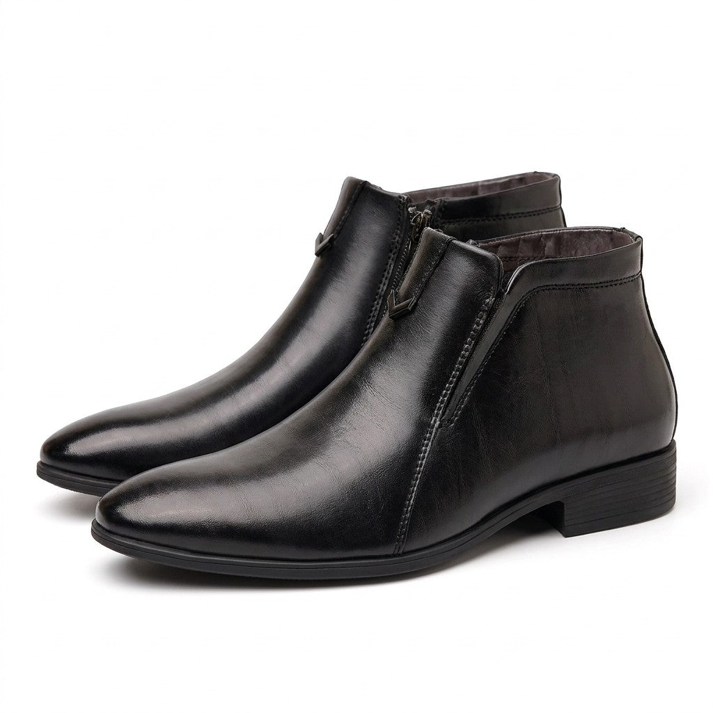 Pair of black polished Ivo dress ankle boots on white with pointed toe and V chevron