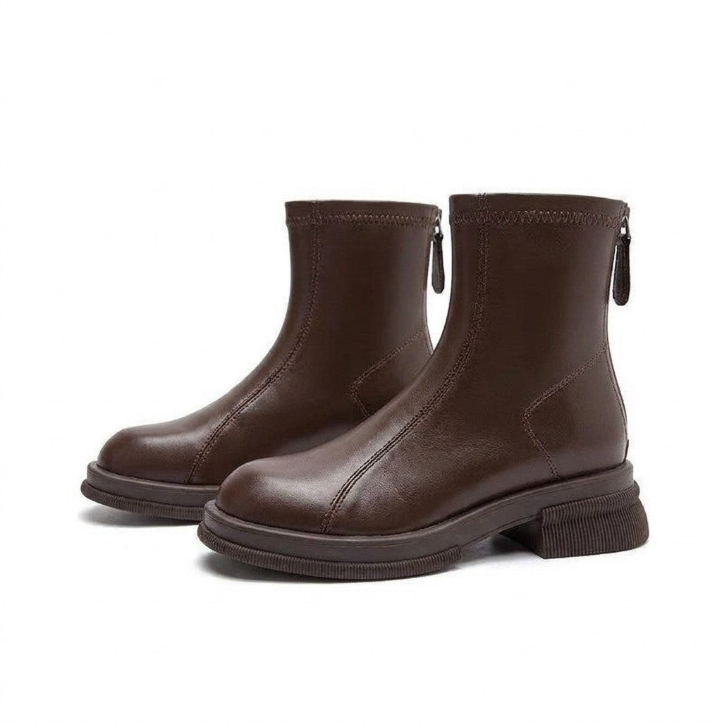 Pair of chocolate-brown Liesel leather ankle boots on white with stretch top band