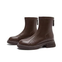 Pair of chocolate-brown Liesel leather ankle boots on white with stretch top band