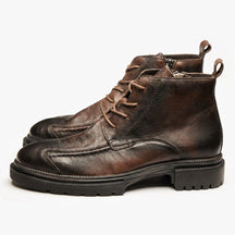 Pair of brown burnished Nils lace-up boots on white with tan round laces and inside zip