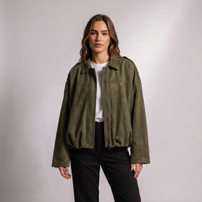 Model in the Army Green Brisa suede bomber with a white T-shirt and black trousers, front view