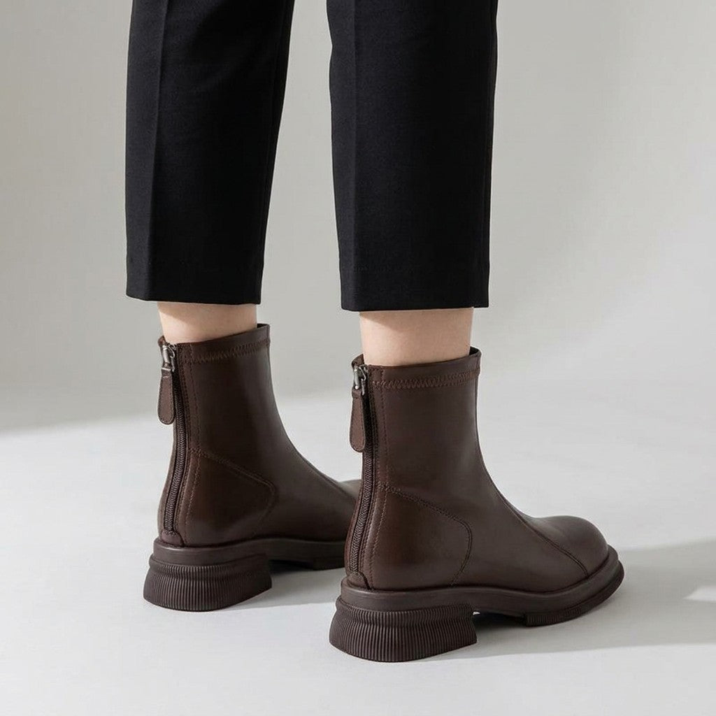 Back view of brown Liesel boots worn with cropped trousers, centre-back zips visible