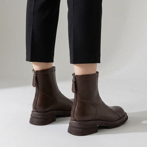 Back view of brown Liesel boots worn with cropped trousers, centre-back zips visible