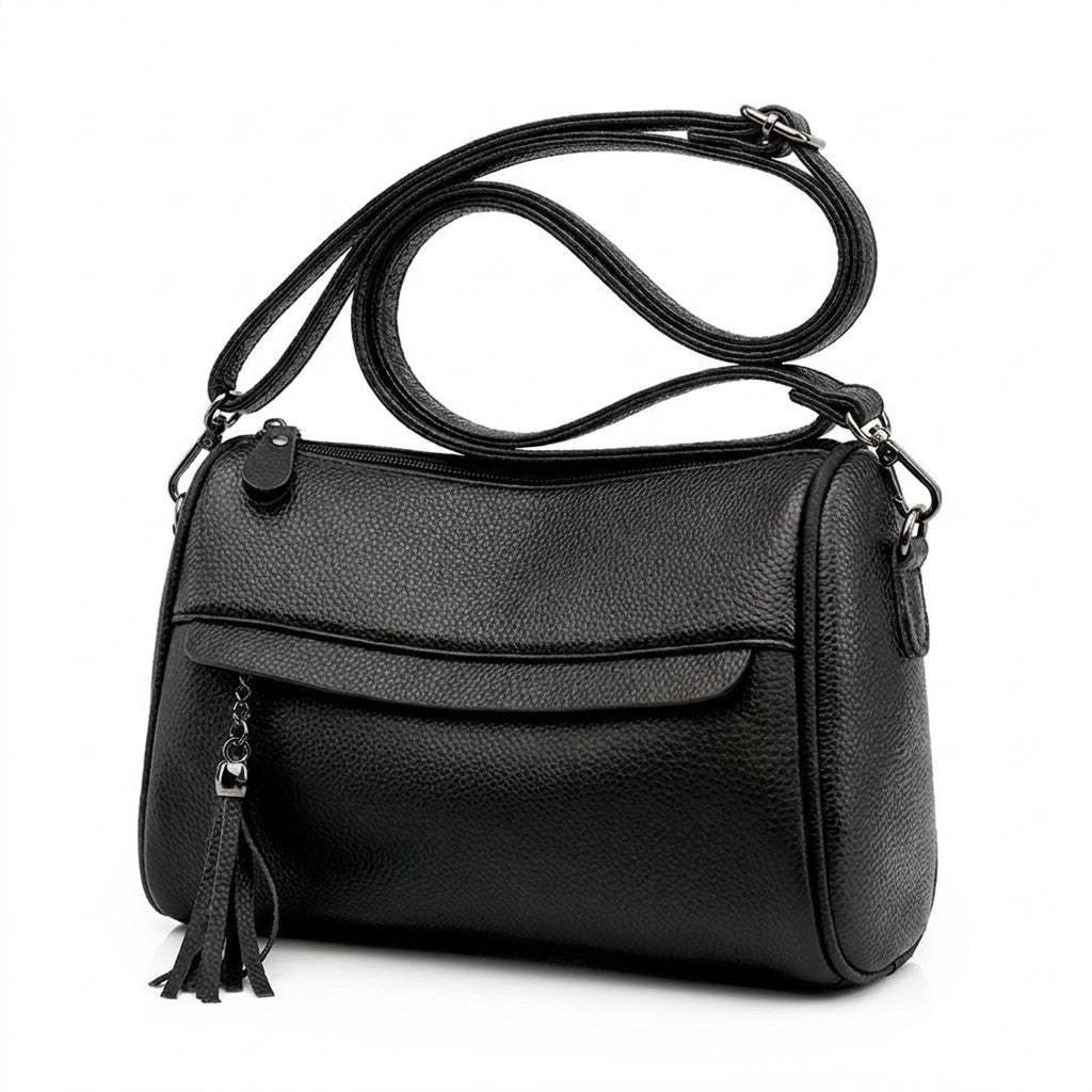 Three-quarter view of the Odalys black barrel bag showing the rounded end and swivel clasp
