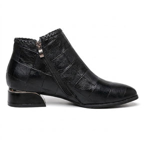 Inner side of the black Tamsin ankle boot on white with diagonal side zip