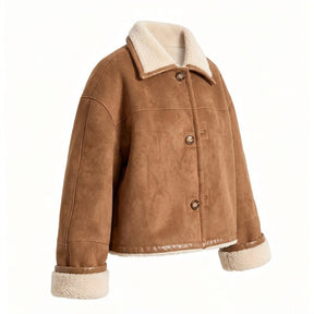 Three-quarter view of the Greta suede shearling jacket on white with leather-bound hem