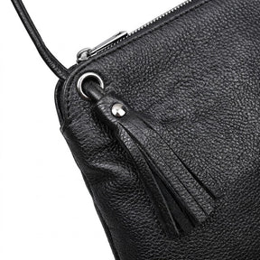 Close-up of the Solveig leather tassel, silver eyelet and knotted cord