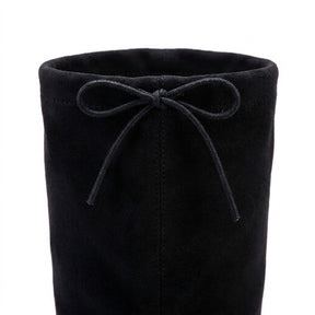Close-up of the Oriane back drawstring bow and centre-back seam on black stretch suede