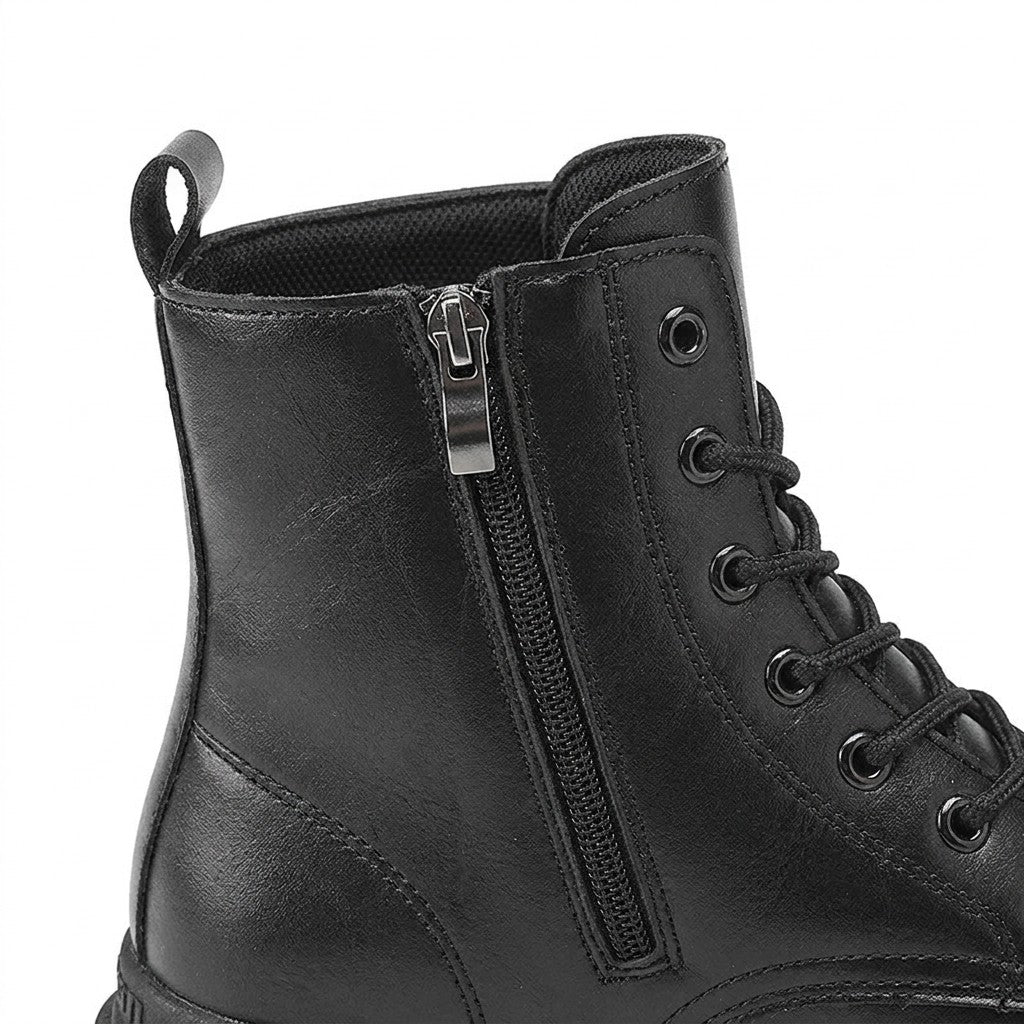 Close-up of the Matthis side zip, metal eyelets and padded collar
