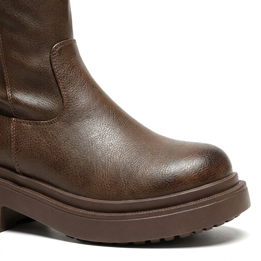 Close-up of the Mirabel burnished brown toe, ankle overlay stitching and layered platform sole