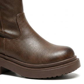 Close-up of the Mirabel burnished brown toe, ankle overlay stitching and layered platform sole