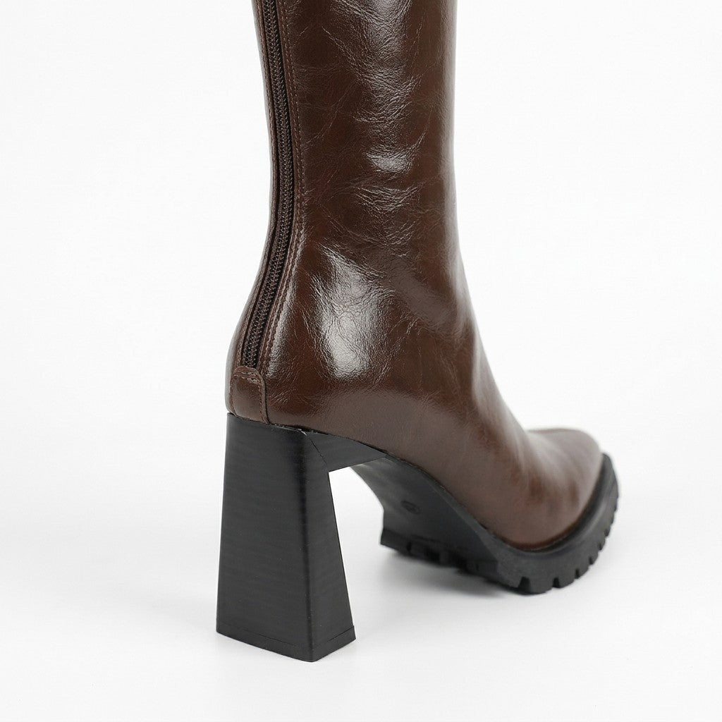Close-up of the Mirela flared block heel, lug sole and centre back zip