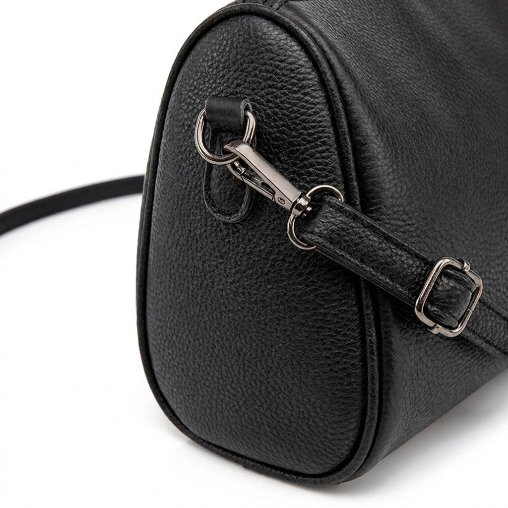 Close-up of the gunmetal swivel clasp and strap buckle on the side of the Odalys