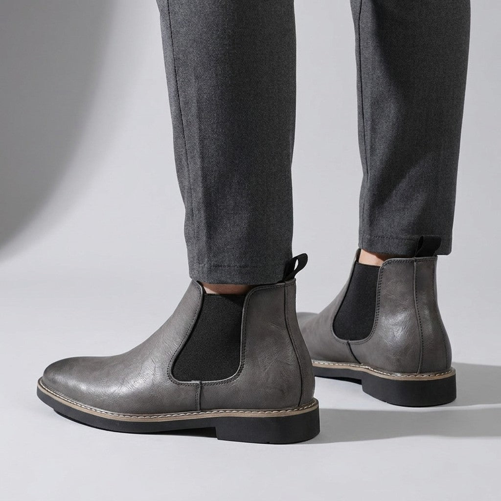 Back view of grey Falk Chelsea boots showing the heel pull tab