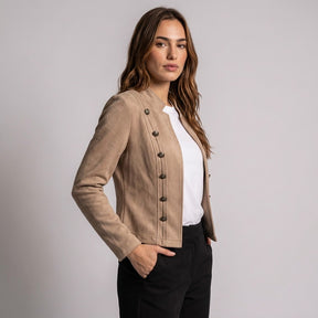Three-quarter side view of the beige Elodie jacket with its button rows