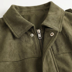 Close-up of the Brisa metal zip and silver press stud under the suede point collar