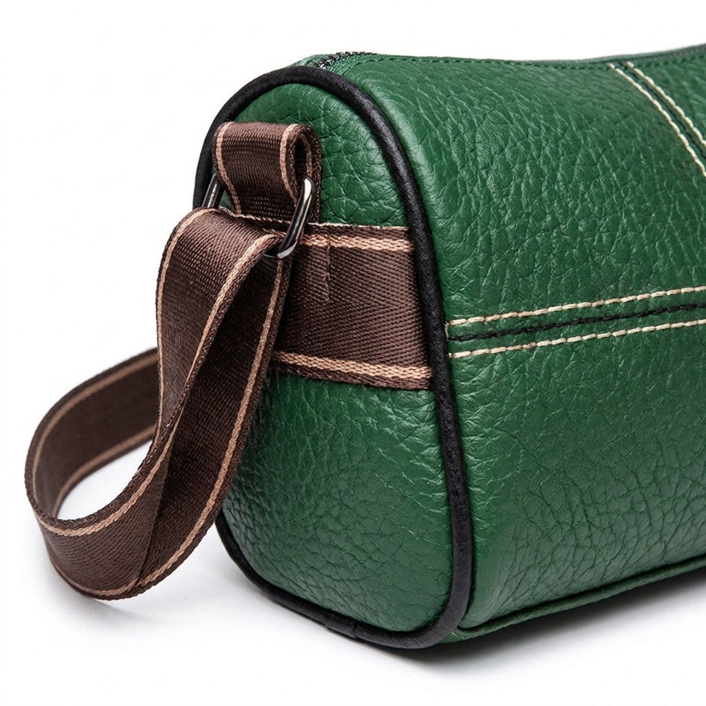 Close-up of the Bellamy side end showing the pebbled grain, woven side band, metal ring and strap